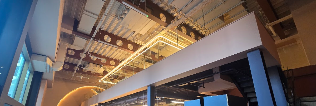Frameless glass mezzanine balustrades in a Manchester commercial fit-out by Manchester Balustrades